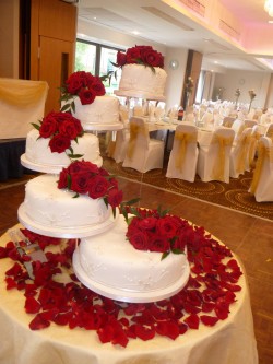 5 tier wedding cake with red roses