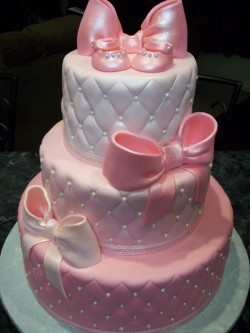 Baby shower cake with pink ribbons