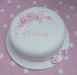 Christening cake with pink flowers