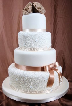 Wedding cake with brown ribbon