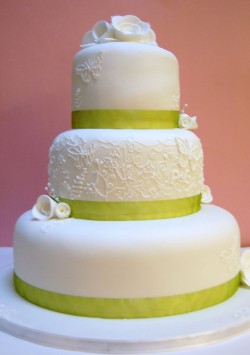 Wedding cake with green ribbon